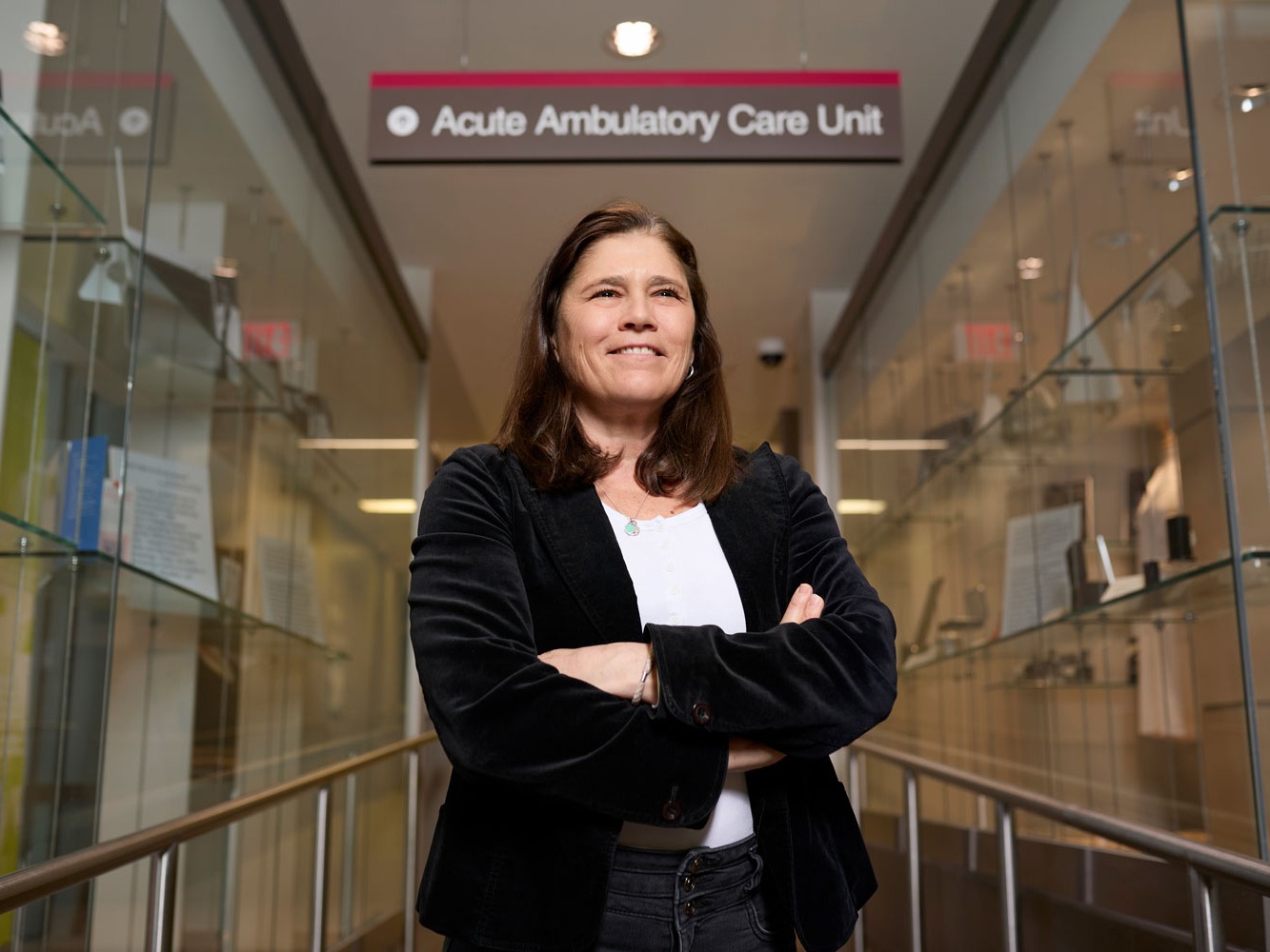 Janis MacDonald standing in front of the Acute Ambulatory Acute Unit (AACU)